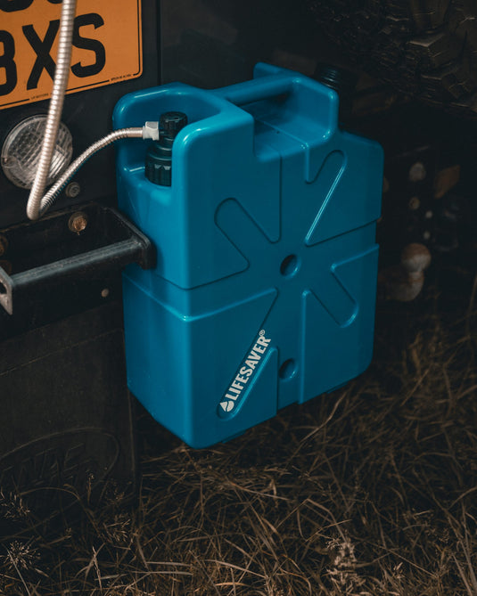 Blue LifeSaver Jerrycan fixed to the back of a landrover