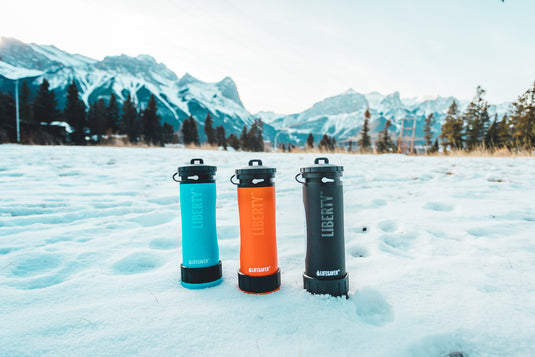 Liberty water bottles in a snowy mountainside