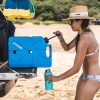 Woman using LifeSaver Jerrycan to fill bottle with clean water from an overlander vehicle