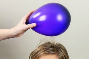 Hair attracted to a balloon due to static illustrates how adsorptive technology is used in water purification